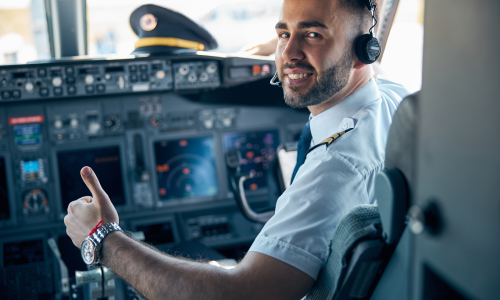 airplane-pilot-gives-thumbs-up-inside-cockpit-2026-01-05-06-15-58-utc
