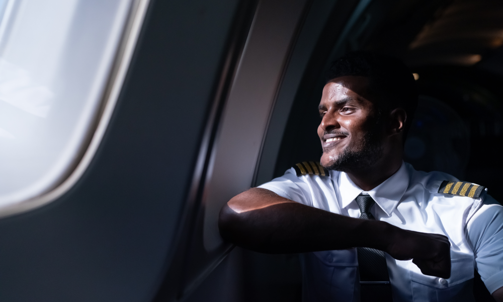 happy-young-pilot-in-professional-uniform-at-airpo-2026-03-18-07-09-20-utc